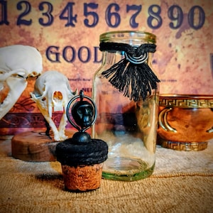 Antique apothecary bottle with decorative topper