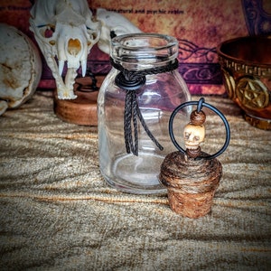 Antique apothecary bottle with decorative topper