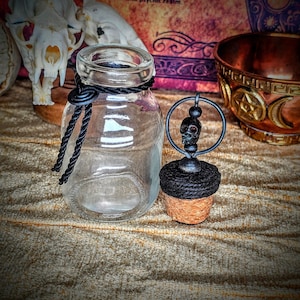 Antique apothecary bottle with decorative topper