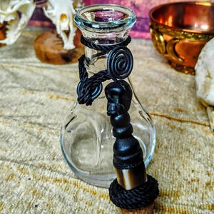 Antique apothecary bottle with decorative topper