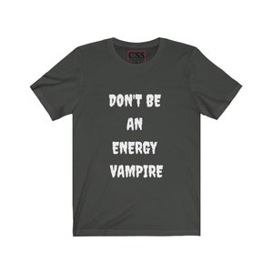 May include: Dark gray t-shirt with white text that reads "Don't be an energy vampire".