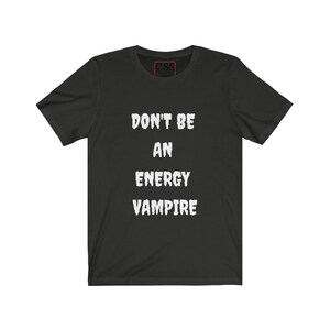 May include: Black t-shirt with white text that reads "Don't be an energy vampire."