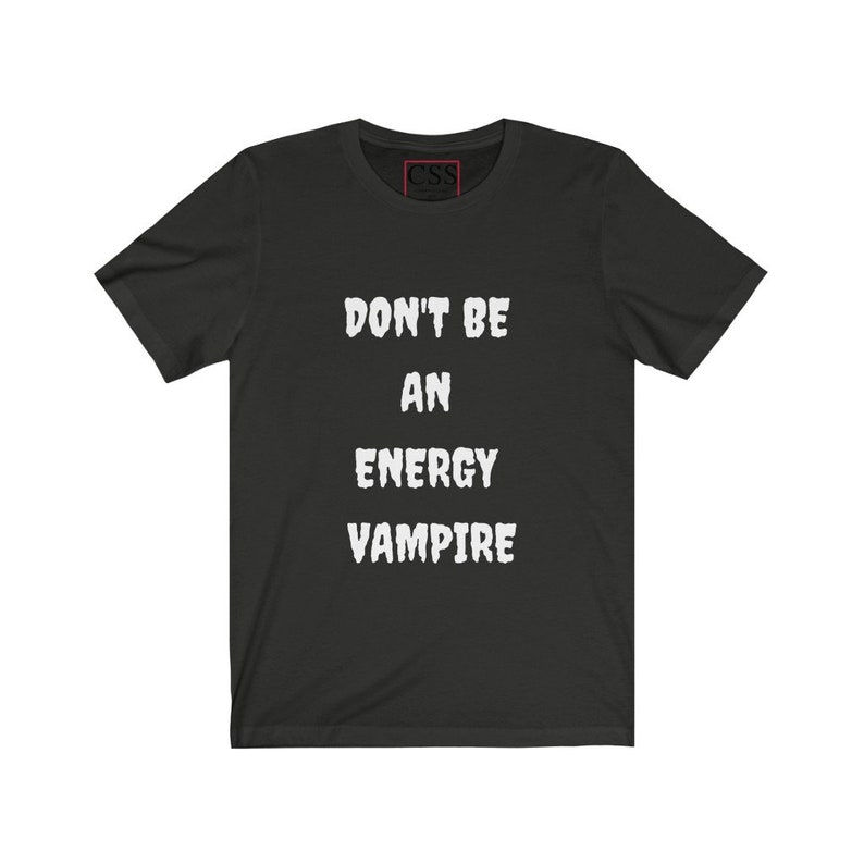 May include: Black t-shirt with white text that reads "Don't be an energy vampire."