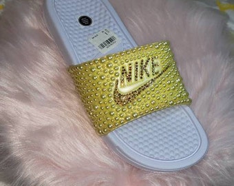 blue and gold nike slides