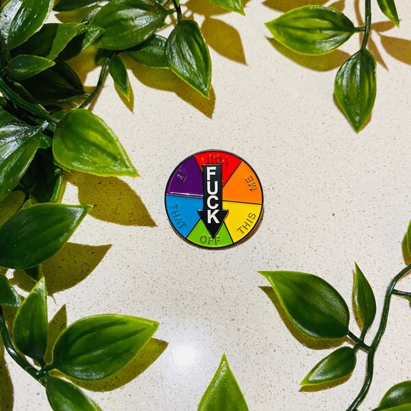 Offensive Spinning funny pin badge