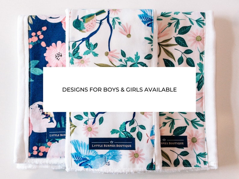 May include: Three fabric burp cloths with different floral and bird patterns. The cloths are white with blue, green, and pink accents. The text "Designs for boys & girls available" is displayed on a white banner.