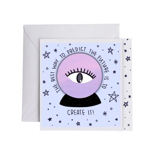 May include: A greeting card with a light blue background featuring a purple crystal ball with an eye design. The text reads "The best way to predict the future is to create it!" The card is accompanied by a white envelope.