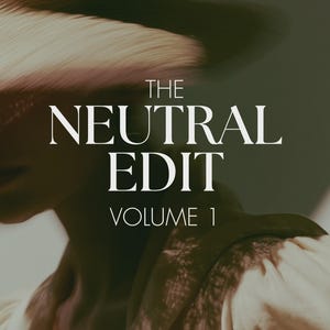 May include: A graphic design featuring the white text THE NEUTRAL EDIT VOLUME 1 centered over a blurred, dark-toned image of a person wearing a wide-brimmed hat and a textured garment. The overall aesthetic uses muted, earthy, and dark color tones.