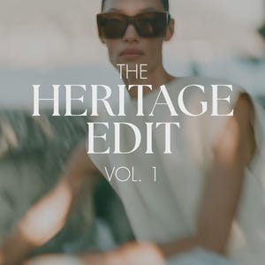 May include: A sleeveless cream-coloured top worn with dark-tinted sunglasses. The image features the white text THE HERITAGE EDIT VOL. 1 centred over the garment. The focus is on the upper torso and head, capturing the neutral tones and clean lines.