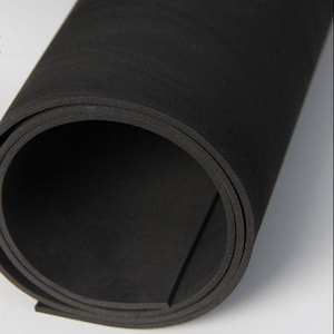 May include: A roll of black foam sheet material. The foam is flexible and has a smooth surface.