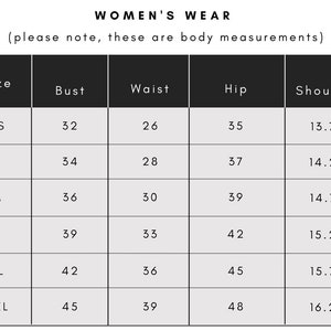 May include: A size chart for women's wear with measurements in inches for bust, waist, hip, and shoulder. The sizes listed are XS, S, M, L, XL, and XXL.