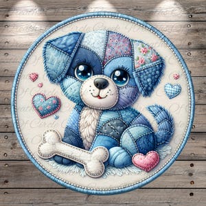 May include: A round, fabric art piece featuring a patchwork puppy dog with large blue eyes and a bone. The dog is primarily blue with patches of different patterns. Pink hearts and a blue border complete the design.