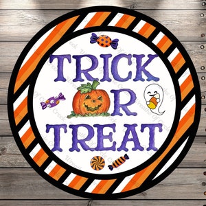 May include: A round, white sign with orange and black stripes around the edge. The sign says "Trick or Treat" in purple letters. There is a jack-o-lantern and a ghost on the sign.