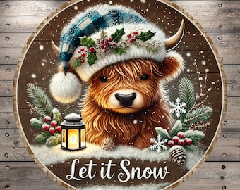 May include: Round wooden sign featuring a Highland cow wearing a blue plaid and white winter hat with holly berries. The sign has the text "Let it Snow" and is surrounded by winter foliage and a lantern.