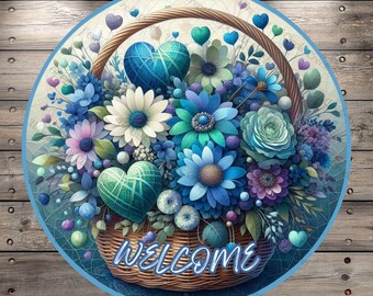 May include: A round welcome sign with a blue and white floral arrangement in a wicker basket. The flowers are blue, white, and purple with green leaves. The basket has the word "WELCOME" written on it.