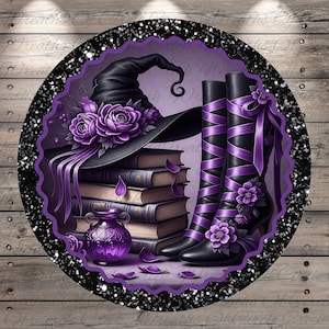 May include: A digital illustration featuring a witch-themed design. It includes a black witch hat adorned with purple roses, a stack of books, black boots with purple ribbons and flowers, and a purple decorative bottle. The design is set within a black glitter frame.