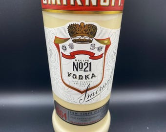 Upcycled Smirnoff* Vodka bottle crafted into a soy wax candle. Fragranced with vanilla.