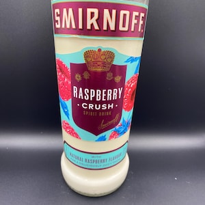 Upcycled Smirnoff* Raspberry Vodka bottle crafted into a soy wax candle. Fragranced with raspberry.