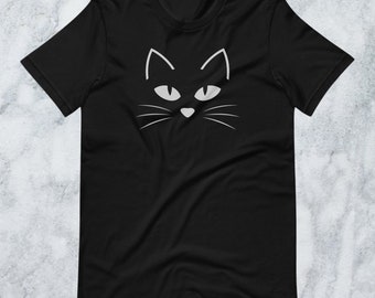 Minimalist Black Cat T-Shirt – Halloween Cat Lover Tee with Cute Feline Face, Spooky Season Fashion, Bella + Canvas 3001, Cat Graphic Design