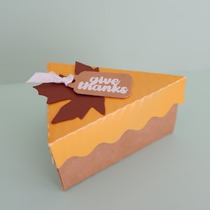 An orange mini pie box using Cricut.