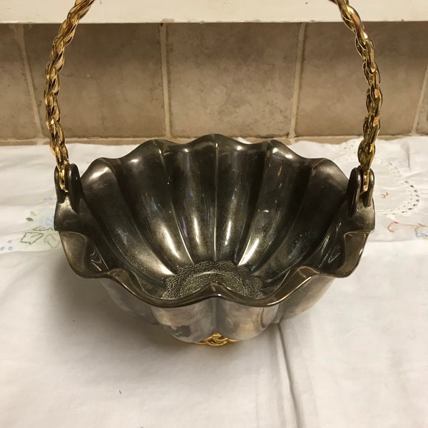 Sterling plated basket with gold/brass braided handle and base.