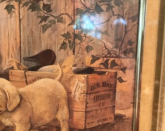 Vintage lithograph of 2 golden lab puppies who have gotten into their owners duck decoys.
