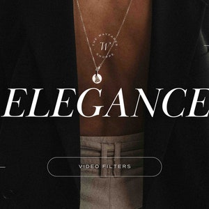 May include: A person wearing a black blazer with a silver necklace that has a pendant with the text "The Wayfarer Shoppe" and the letters "TW". The text "Elegance" is displayed in white letters on a black background. A white button with the text "Video Filters" is displayed below the text.
