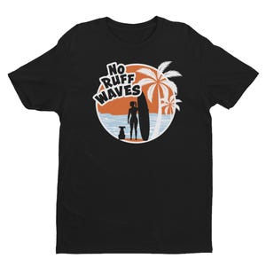 May include: A black short-sleeved t-shirt featuring a circular graphic of a sunset over the ocean with a palm tree, a person holding a surfboard, and a dog. The text "NO RUFF WAVES" is printed in white letters at the top of the circular design.