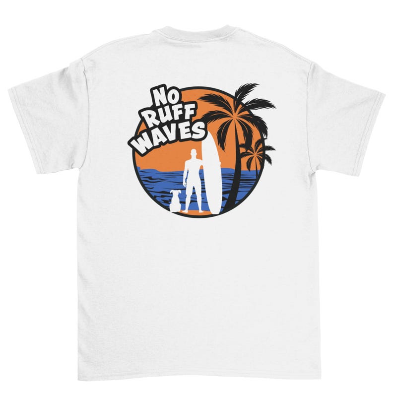 May include: A white t-shirt featuring a circular graphic on the back. The design shows a silhouette of a person holding a surfboard next to a dog, with palm trees, an orange sun, and blue ocean waves. The text NO RUFF WAVES is printed in white.