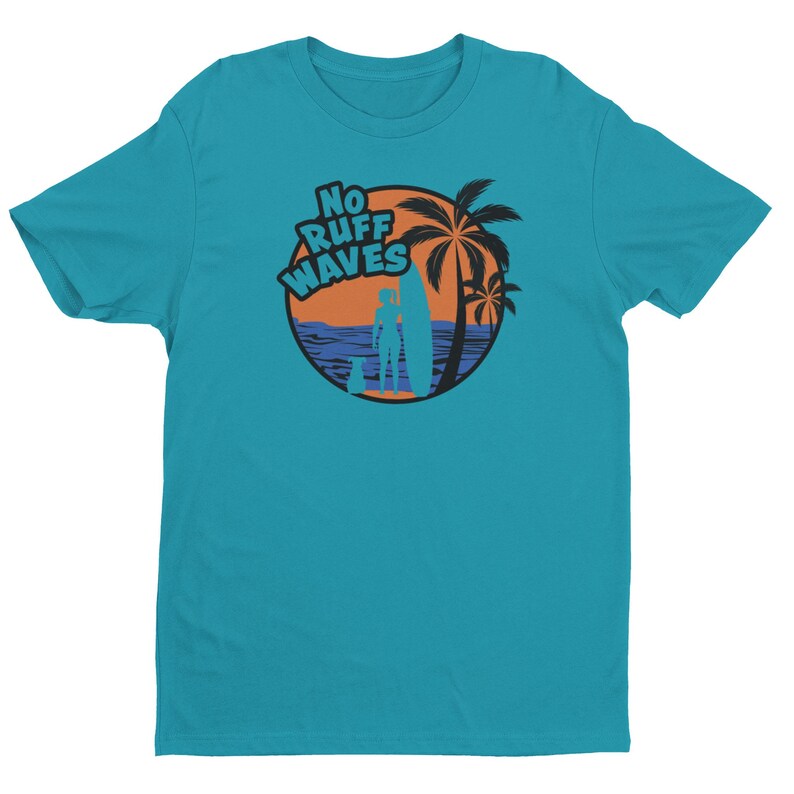 May include: A teal short-sleeved t-shirt featuring a circular graphic on the chest. The design displays an orange sunset, a blue ocean, palm trees, a silhouette of a person with a surfboard, and a dog, with the text NO RUFF WAVES in blue.