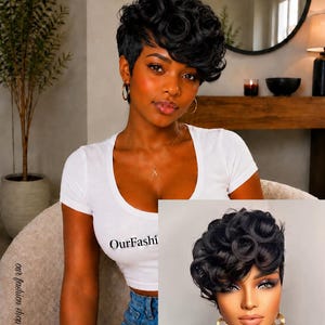 May include: A short, black, curly pixie cut wig featuring voluminous, tight curls on top and tapered sides. The hair is styled with a side-swept fringe that frames the forehead. The wig is displayed on a mannequin head with a neutral complexion.