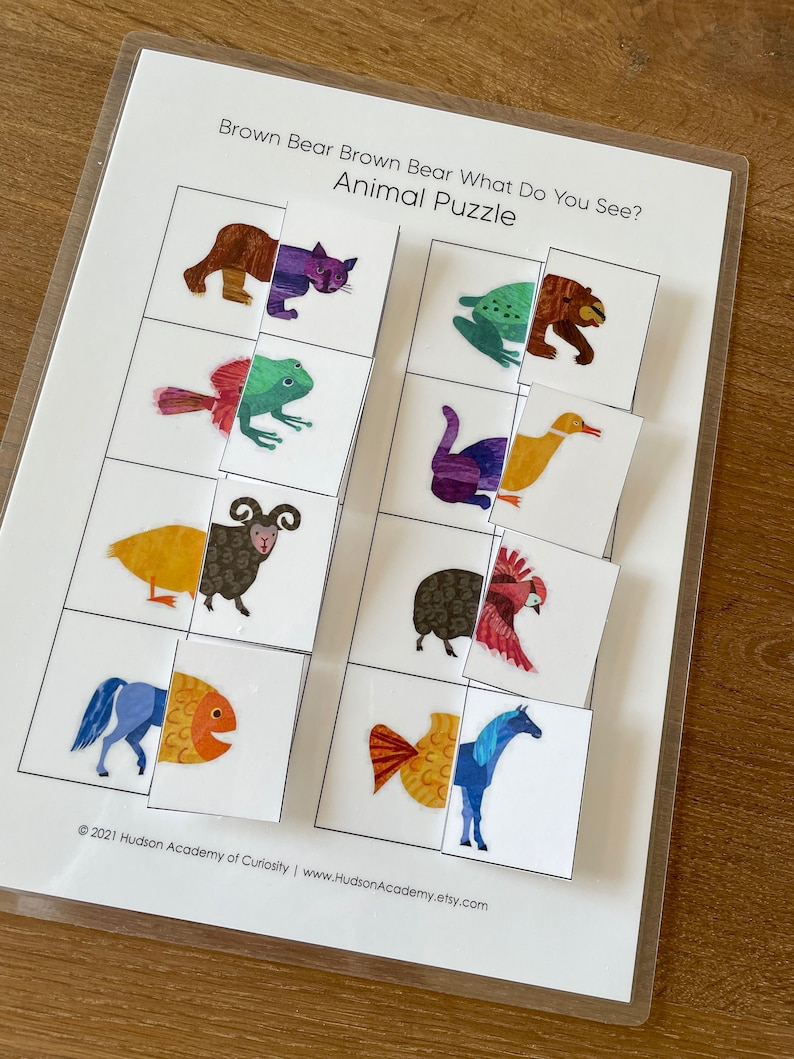 May include: A printable educational game for kids featuring a brown bear, a cat, a frog, a duck, a sheep, a rooster, a fish, and a horse. The game is titled "Brown Bear Brown Bear What Do You See? Animal Puzzle".