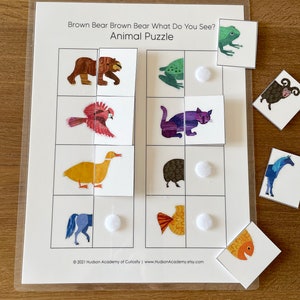 May include: A brown bear, a frog, a bird, a cat, a duck, a hedgehog, a horse, and a fish are pictured on a white background. The animals are part of a matching game for children. The text "Brown Bear Brown Bear What Do You See? Animal Puzzle" is at the top of the page.