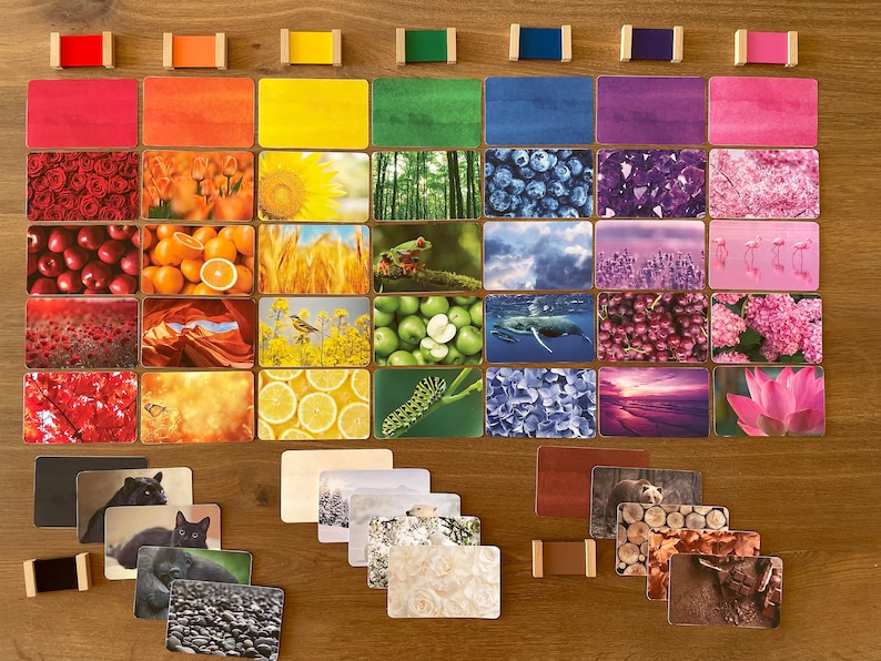 May include: A set of color matching cards featuring various images of nature, animals, and objects. The cards are arranged in a rainbow pattern, with each color represented by a row of cards. The cards are made of sturdy cardstock and are perfect for use in a classroom or at home.