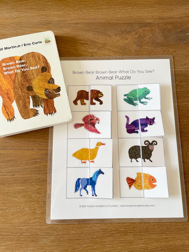 May include: A printable educational game for children featuring a brown bear, a frog, a bird, a cat, a duck, a sheep, a horse, and a fish. The game is titled "Brown Bear Brown Bear What Do You See? Animal Puzzle".