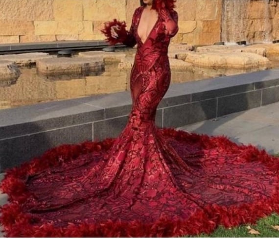 Engagement in luxury off shoulder red gown with partner in black - photo by  Tom Russo Photography