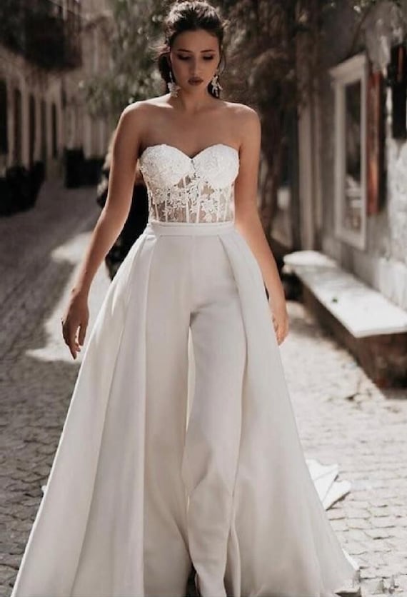 White One Shoulder Cape Sleeve Jumpsuit #white #jumpsuit #with #train  #whitejumpsuitwithtrain The sle… | Rehearsal dinner outfits, Bridal jumpsuit,  Wedding jumpsuit
