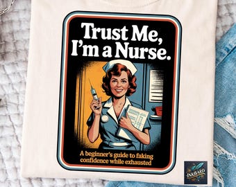 May include: A cream-coloured t-shirt with a retro illustration of a smiling nurse holding a syringe and clipboard. Text reads "Trust Me, I'm a Nurse." Below, "A beginner's guide to faking confidence while exhausted."