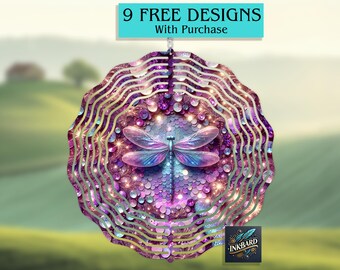 May include: A decorative, layered metal wind spinner featuring a dragonfly design. The spinner has a purple, pink, and blue color scheme with a sparkling, sequined background. The text "9 FREE DESIGNS With Purchase" is displayed above the spinner.