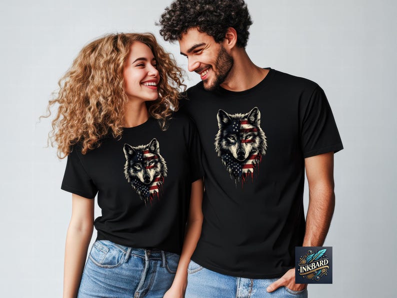 a man and a woman wearing black t - shirts with wolf heads on them