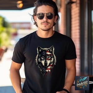 a man wearing a black shirt with a wolf on it