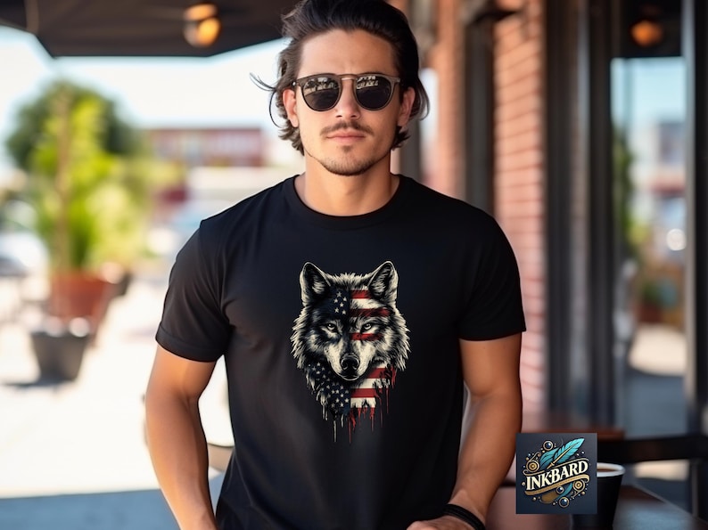 a man wearing a black shirt with a wolf on it