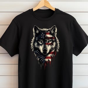 a black t - shirt with an american wolf on it