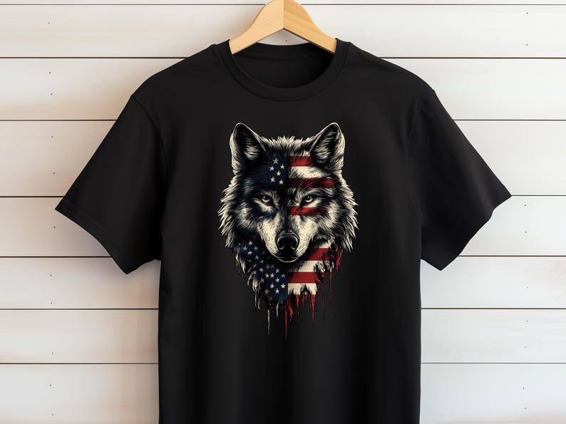 a black t - shirt with an american wolf on it