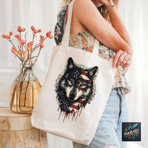 a woman holding a white bag with a wolf on it