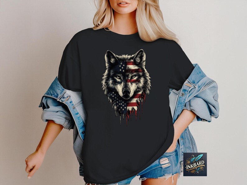 a woman wearing a black shirt with an american wolf on it