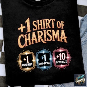 May include: Black t-shirt featuring the text "+1 Shirt of Charisma" in gold. Below are three icons with the text "+1 Charisma", "+1 Cold Resist", and "+10 Intimidate". The shirt is on a black and white checkered surface.