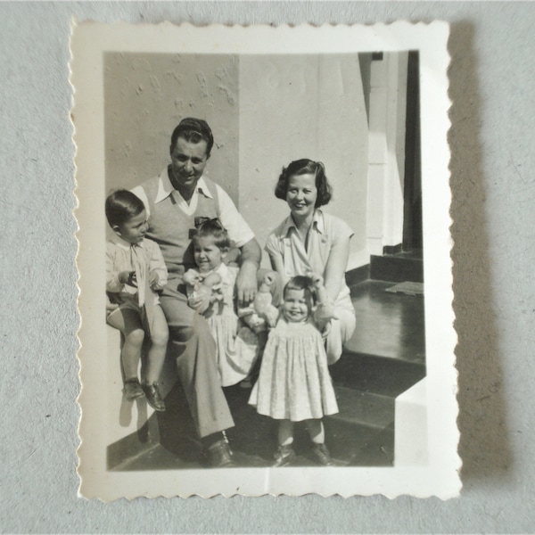 Original Vintage Photograph . Father and Mother with their Children. Happy Family . 1952