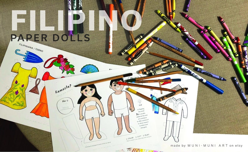 May include: A set of printable paper dolls featuring Filipino clothing. The dolls are ready to be colored and cut out. The set includes a girl wearing a Filipiniana dress, a boy wearing a Barong Tagalog, and a girl wearing a simple dress. The paper dolls are accompanied by accessories such as an umbrella, a flower crown, and a fan. The text "Kamusta?" is written on the paper doll sheet.
