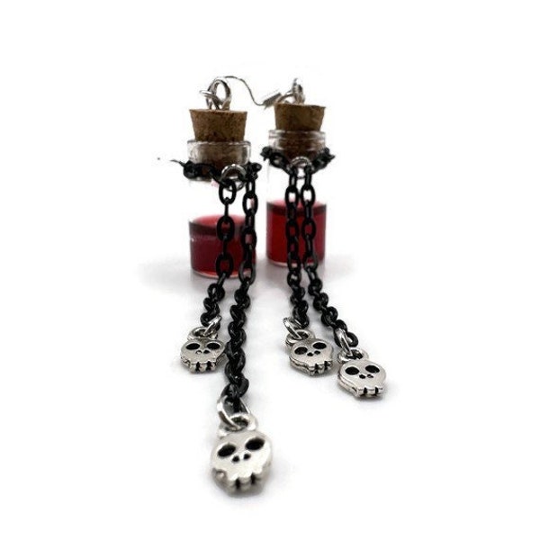 Blood vial and skull earrings